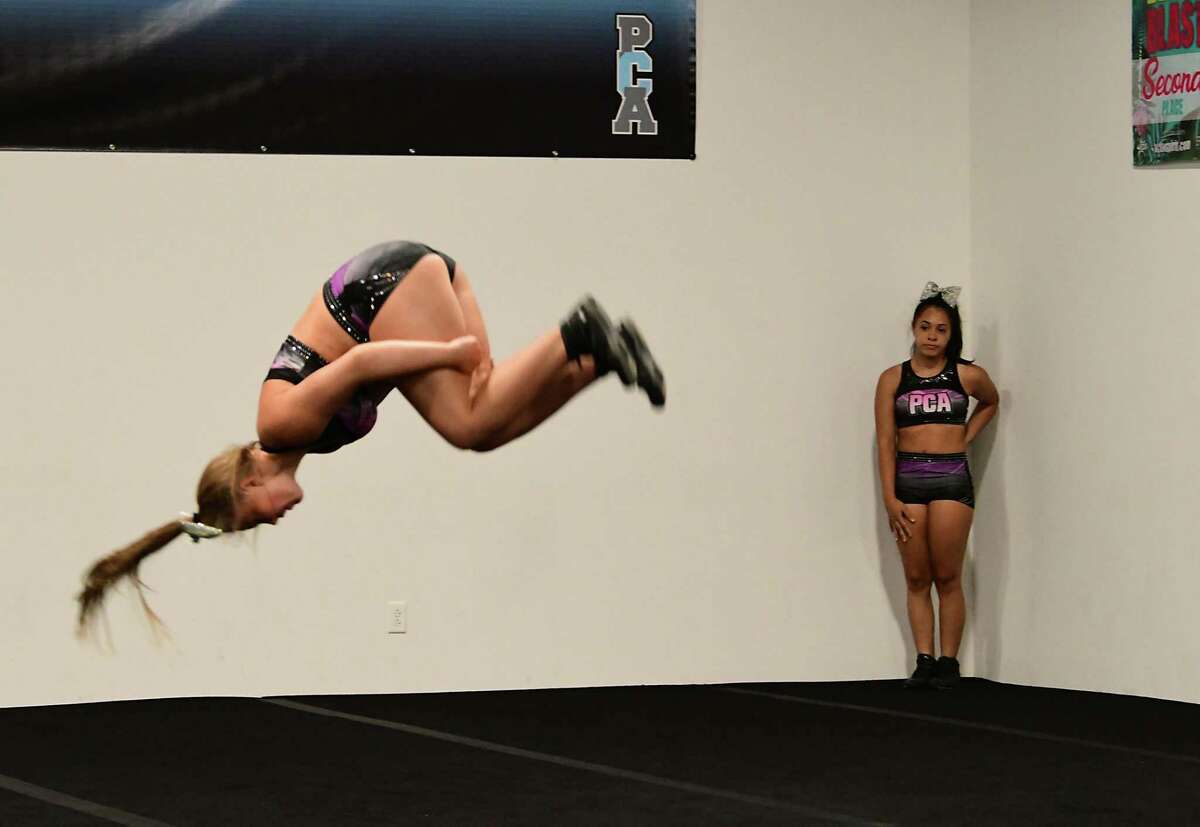 Miranda Diaz, 14, of Albany, right, watches Alex Joslyn, 15, of Latham practice a routine during tryouts for the group's hip-hop competitive team at Premier Cheer Academy on Friday, July 17, 2020 in Albany, N.Y. (Lori Van Buren/Times Union7