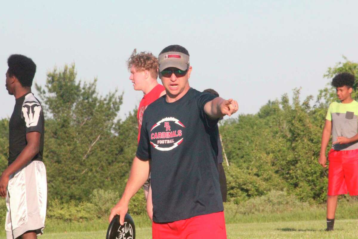 Big Rapids football coach Mike Selzer directs his players during a recent conditioning session. Selzer and other coaches are still hoping to start their practices on time Aug. 10 for football and Aug. 12 for other sports. (Pioneer file photo)