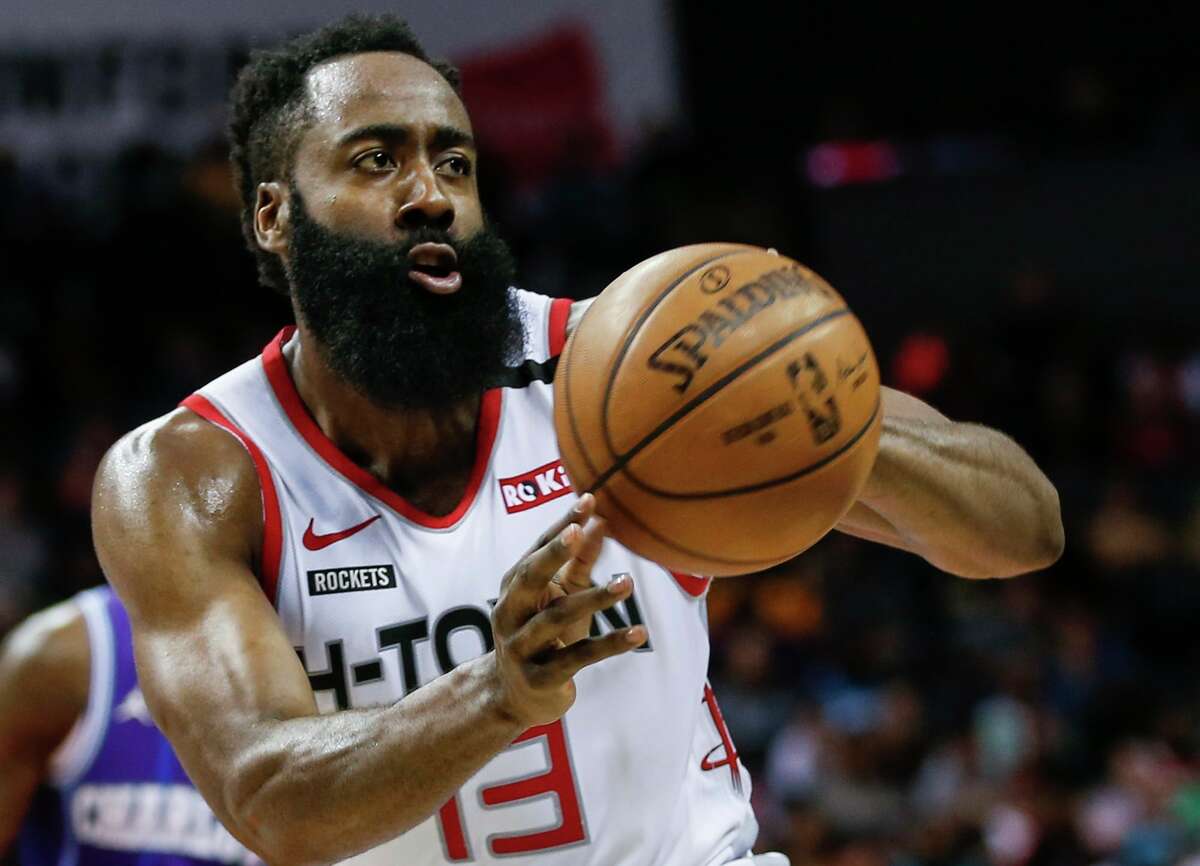 FILE - In this Saturday, March 7, 2020, file photo, Houston Rockets guard James Harden passes against the Charlotte Hornets during the second half of an NBA basketball game in Charlotte, N.C. Harden practiced with his teammates for the first time this summer, Thursday, July 16, 2020, after arriving later than most of the Rockets for the season restart at Walt Disney World. (AP Photo/Nell Redmond, File)