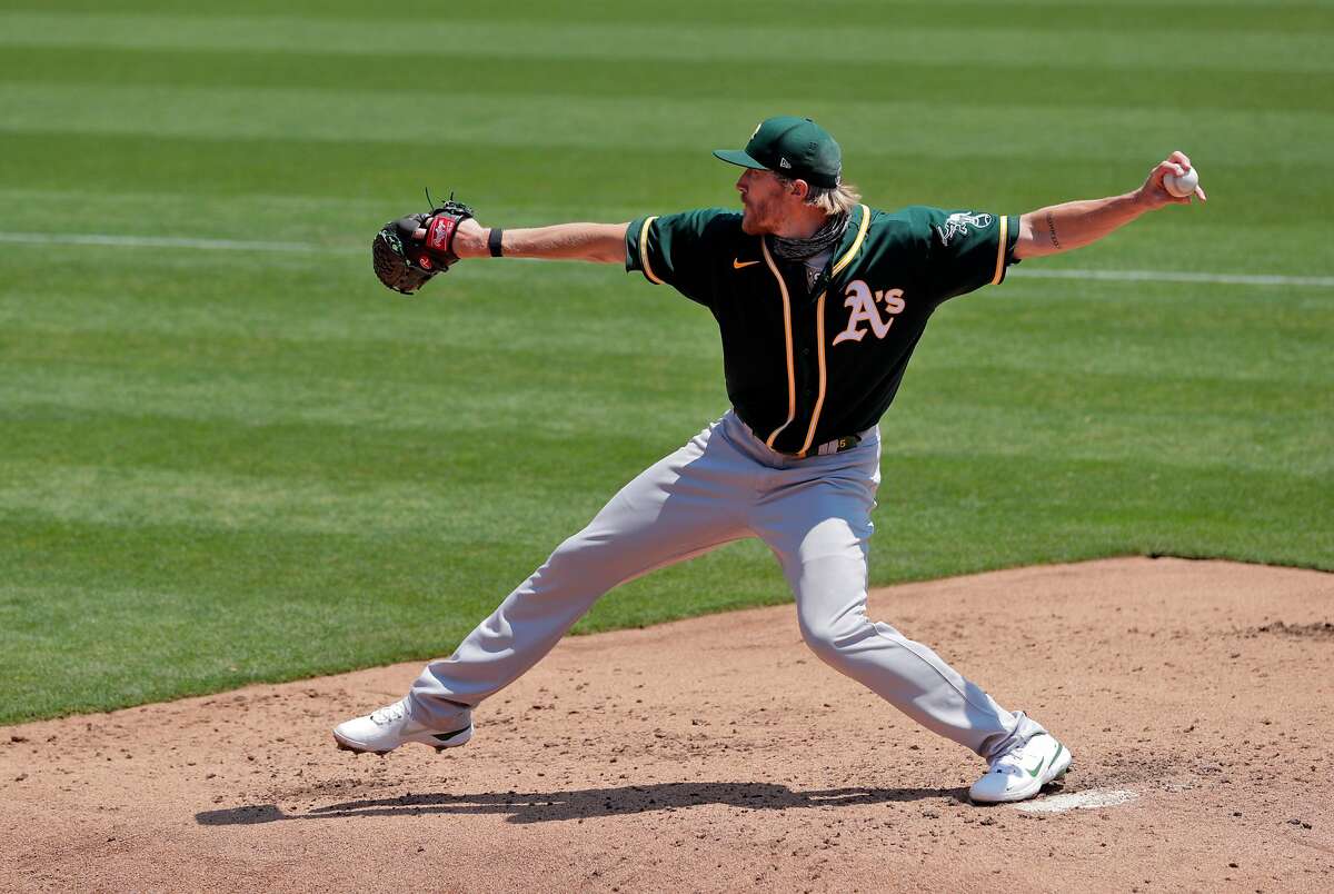 A's reiiever Jake Diekman (35) warms up as the Oakland Athletics played in a simulated game at the Coliseum in Oakland, Calif., on Sunday, July 19, 2020.