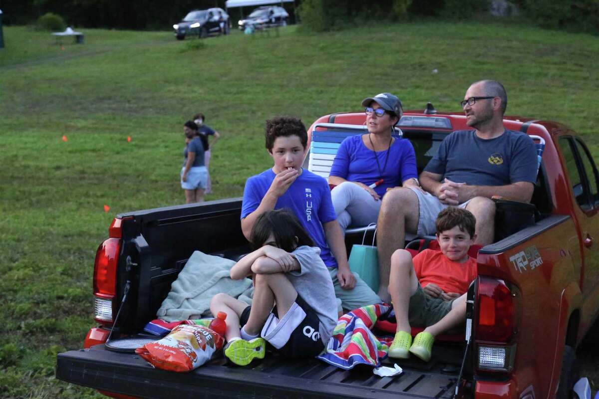 The Schafer family of Weston gets ready to enjoy the movie at the Lachat Town Farm pop-up drive-in movie screening of "Caddyshack" on Sunday, July 19, 2020, in Weston, Conn.