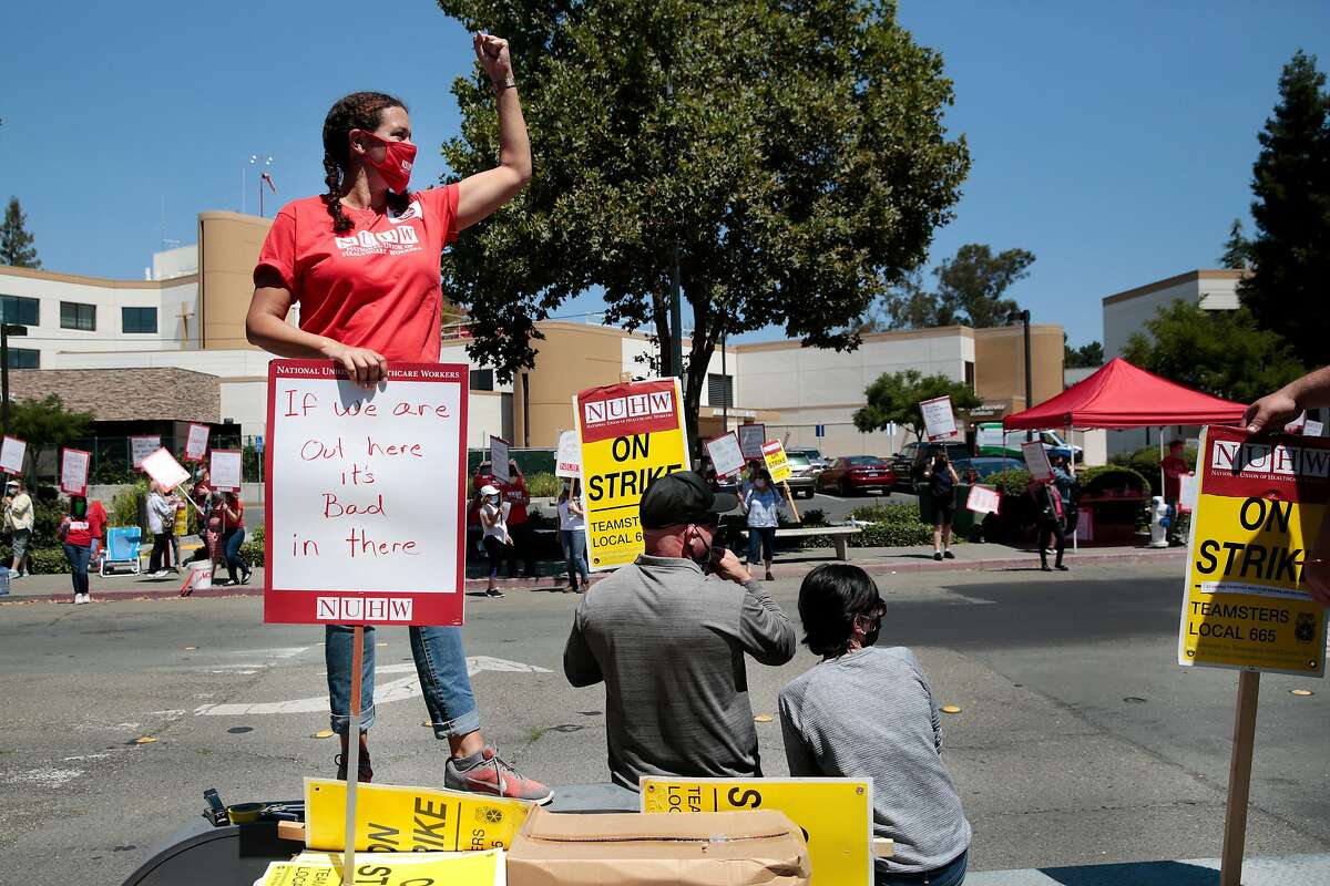 NUHW (National Union of Healthcare Workers) executive board member, shop steward, and emergency room registrar Taylor Davison poses for a portrait during a strike outside Santa Rosa Memorial Hospital in Santa Rosa, California, Monday, July 20, 2020.