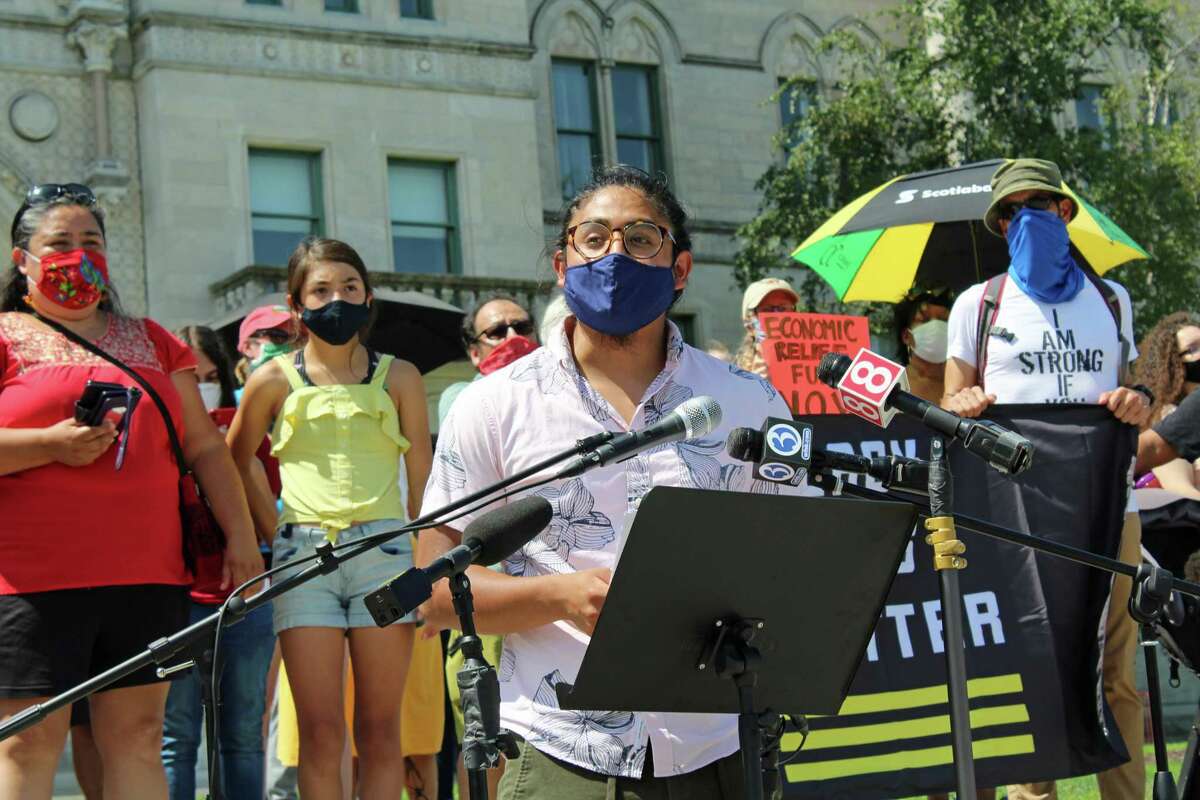 Eric Cruz Lopez, of CT Students for a Dream, speaks at a July 20, 2020 rally at the Connecticut State Capitol, in Hartford, Conn., demanding increased aid for immigrants, among other things.