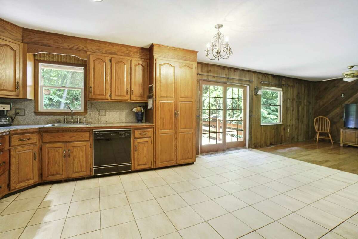 The kitchen is large enough to include a center island or, perhaps a café or breakfast bar. Inside, there is an open floor plan on the main living level, and here’s where the flexibility comes into play. The agent envisions the den as the dining room and the casual eat-in area of the kitchen as a café bar. In turn, the existing dining room could serve as the den.