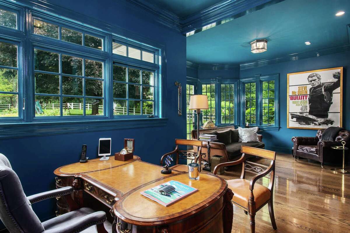 A large flexible room has multiple purposes, one of which could be as an office. While the exterior is casual and relaxing the interior is refined and tasteful.