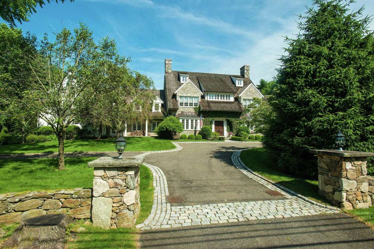 The level of detail inside this home is evident from the moment one pulls into the driveway, which is marked by stone pillars topped with lanterns. The level of detail inside this home is evident from the moment one pulls into the driveway, which is marked by stone pillars topped with lanterns. While most upscale homes feature a paved driveway lined with one row of Belgium block, this driveway's Belgium block is four rows deep, and it leads to a large motor court, which creates an elegant arrival.