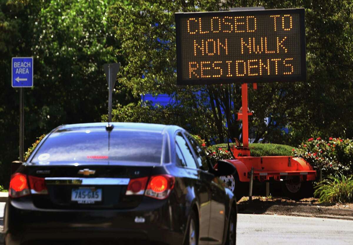 A sign greets motorists outside Calf Pasture Beach in Norwalk on Monday.