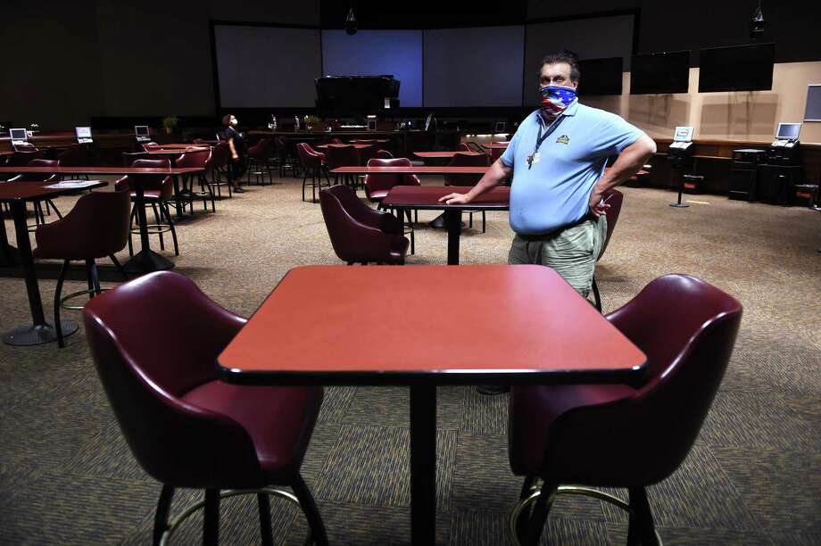 Paul DeRose, facilities director for the Connecticut OTB, is photographed inside the simulcast area of Sports Haven with reduced seating for social distancing. Photo: Arnold Gold / Hearst Connecticut Media / New Haven Register