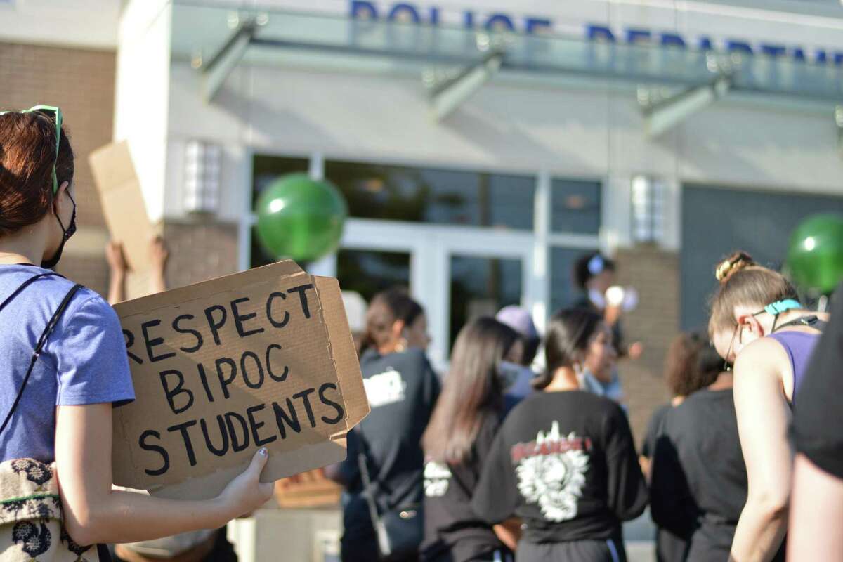 A protest that marched from North Haven High School to the town's police department called for change in the school system regarding racism and defunding the police to invest in community resources.