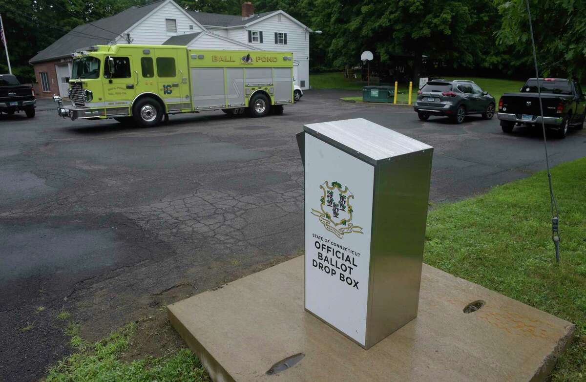 A drop box labeled "State of Connecticut Official Ballot Drop Box" has been installed on a concrete pad at the corner of S King Street and Strawberry Hill Rd at the King Street Volunteer Fire Department. Friday, July 17, 2020, in Danbury, Conn.