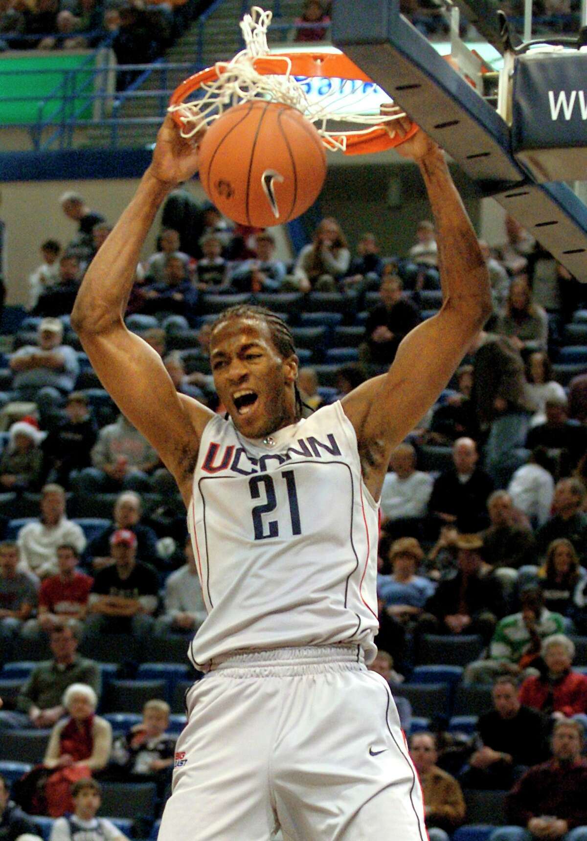UConn’s Stanley Robinson slam dunks for two points in the first half of the college basketball game against Maine in Hartford, Conn., Saturday, Dec. 22, 2007. Robinson scored a career high 32 points.