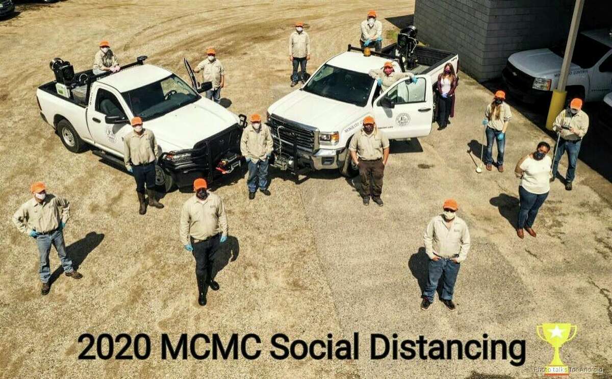 The Midland County Mosquito Control crew take a "social distancing" group photo, posted online in May. (Facebook photo/Midland County Mosquito Control)