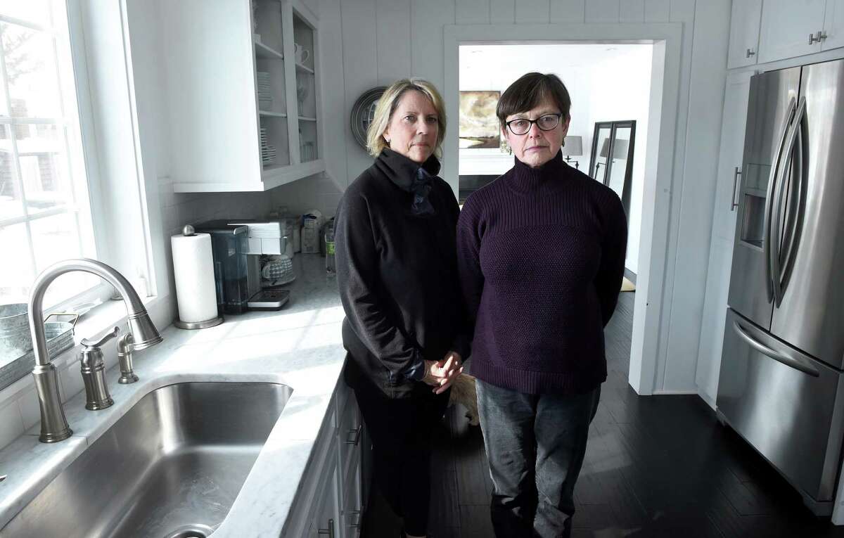 Sue Robins, left, and Melissa Dayton are photographed at Robins’ home in the Mulberry Point section of Guilford on March 6, 2019. Dayton lives in the town’s Tuttle’s Point neighborhood. Both areas are having difficulties with well water. A water main extension project aims to alleviate that.