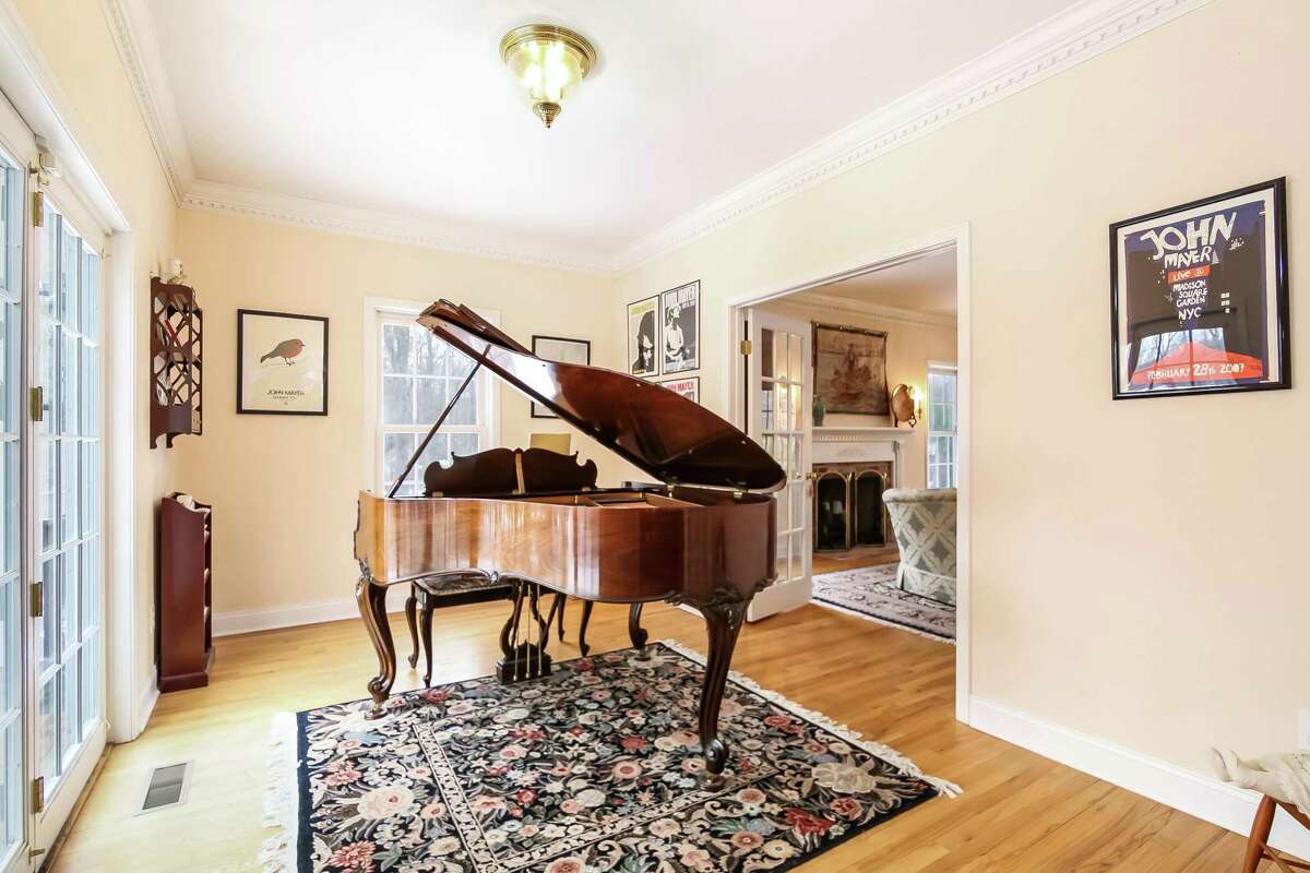 The music room, which has French doors to the wood deck, could instead serve as a home office. This turnkey home has an address on the well-traveled Newtown Turnpike (Route 53) but it is actually located on a private lane off of that roadway. The listing agent said this location on a cul-de-sac affords its residents the best of both worlds; “quiet serenity, yet only a mile to Weston center and award-winning schools.” It is also only about 12 minutes to the Merritt Parkway and 15 minutes to the center of Westport and the Metro-North Railroad station to New York City.