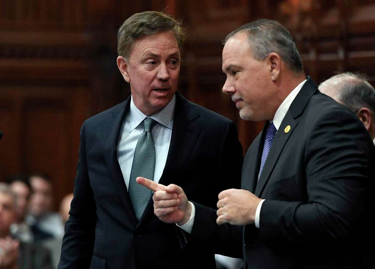 Connecticut Gov. Ned Lamont, left, in a 2019 file photo with Speaker of the House Joe Aresimowicz, who retires when the new legislature takes the oath of office on Jan. 6.