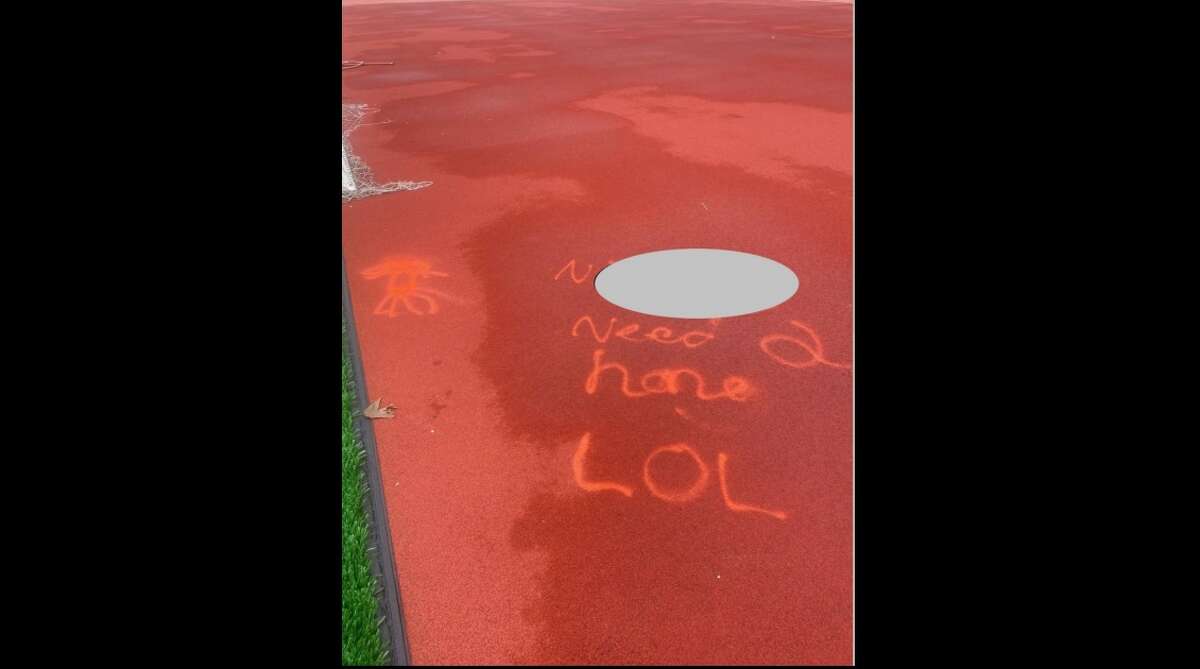 A photo taken from a special edition Midland Public Schools communique on July 22 shows a redacted, racial slur that was vandalized on the track at Midland Community Stadium. (Screen photo/Midland Public Schools special edition communique)