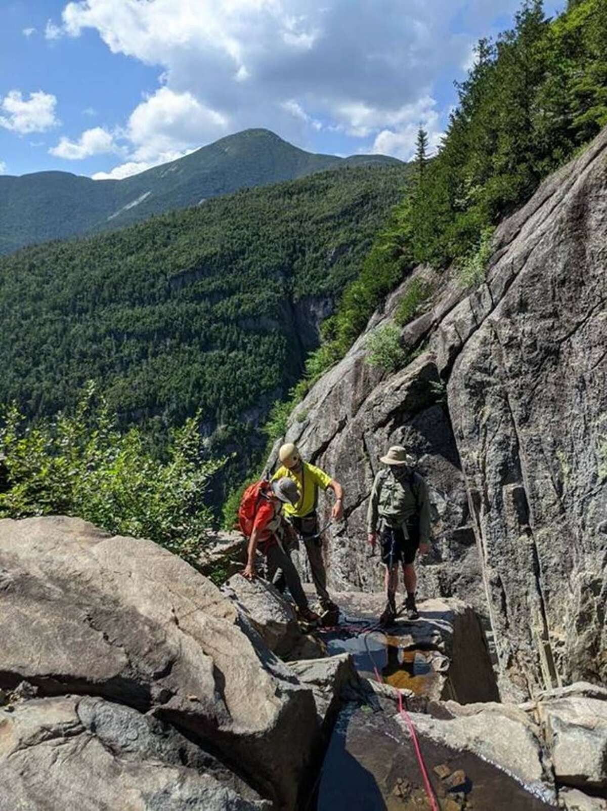 New York State Department of Environmental Conservation forest rangers are seen assisting in the rescue of two hikers stuck on Trap Dike on July 18, 2020, in the Adirondacks. Teens were rescued from the High Peaks on New Year's Eve 2021. Rangers said they were inebriated and halluciating. (NYS DEC)