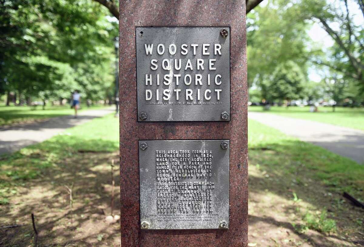 A plaque for the Wooster Square Historic District is photographed at the entrance to Wooster Square Park in New Haven on July 13, 2020.