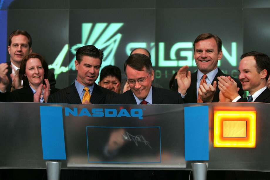 Silgan CEO and Chairman Tony Allott signs his name after ringing the Nasdaq exchange’s opening bell on Feb. 13, 2007. Photo: File Photo