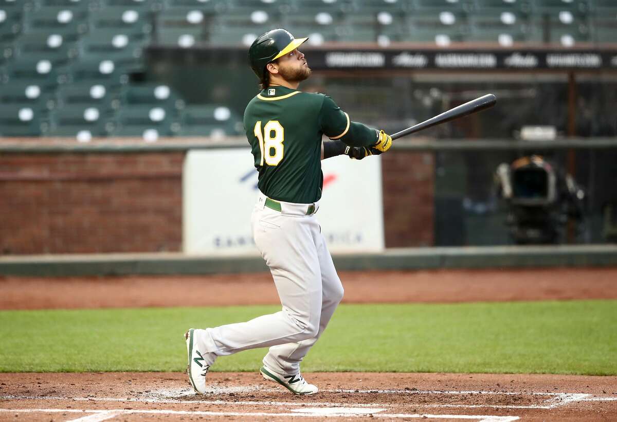 SAN FRANCISCO, CALIFORNIA - JULY 21: Chad Pinder #18 of the Oakland Athletics hits a triple that scored two runs in the second inning against the San Francisco Giants during their exhibition game at Oracle Park on July 21, 2020 in San Francisco, California. (Photo by Ezra Shaw/Getty Images)