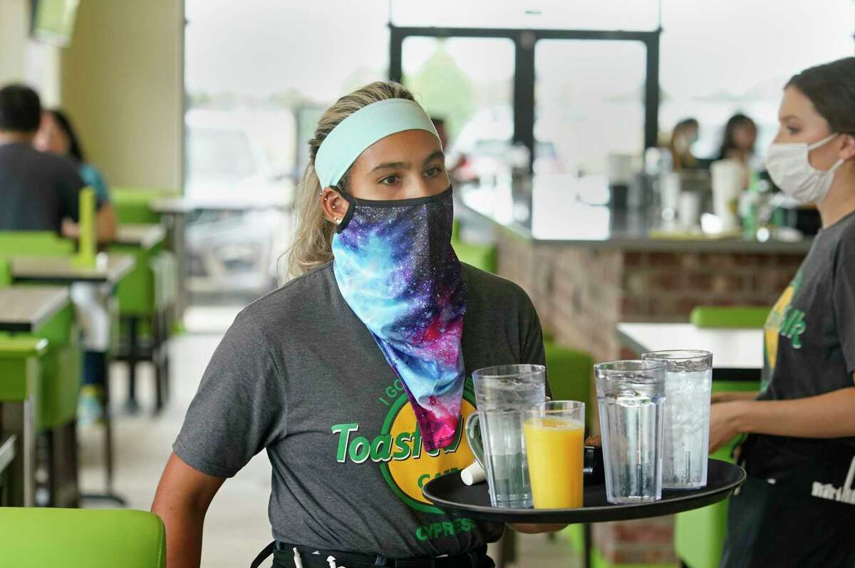 Jocelyn Perez works at The Toasted Yolk, 27008 Highway 290, Saturday, July 18, 2020, in Cypress.