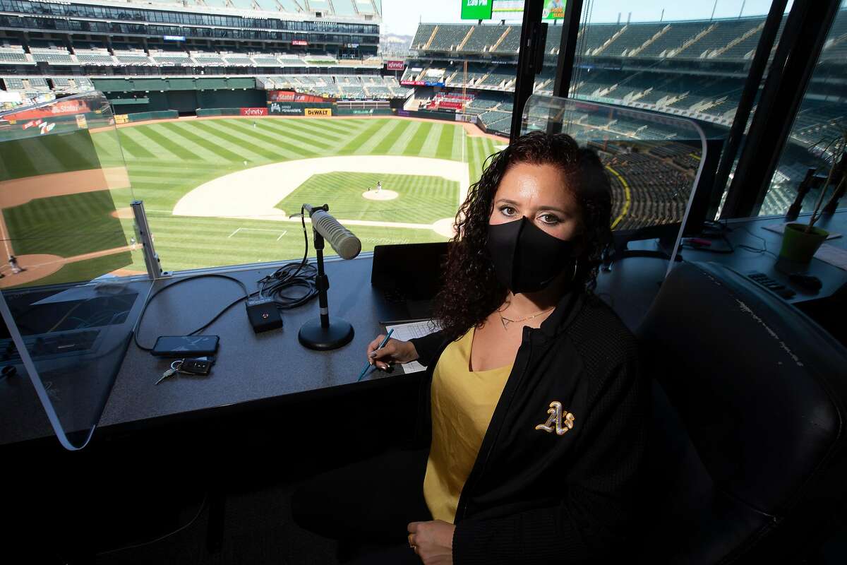 Oakland Athletics public address announcer Amelia Schimmel poses for a photograph in the announcer�s booth at the Coliseum before the start of the regular season Thursday, July 23, 2020 in Oakland, Calif. Schimmel is filling in for long-time A�s PA man Dick Calahan during the coronavirus pandemic.