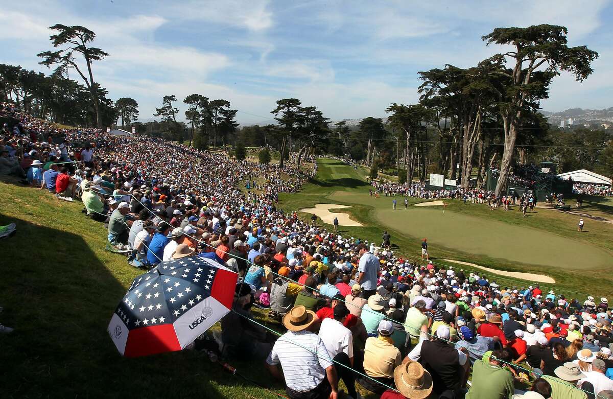 Thousands of golf fans surround the 8th hole during the third round of the 112th U.S. Open at The Olympic Club on Saturday June 16, 2012 in Daly City, California.