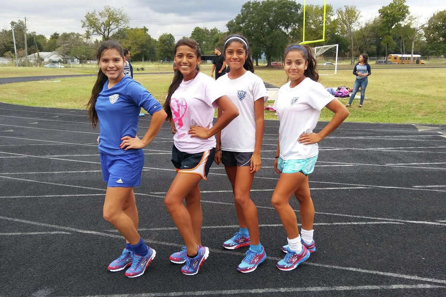 Esmeralda Pantoja, Frida Hernández, Jocelyn Sierra and Vanessa Guillén, left to right, in November 2017 when they were training at the César E. Chávez High School track for the Houston half Marathon. (Courtesy Megan Giles-Franklin)
