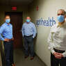 Carl Sgambati, M.D., left, chief medical officer for aptihealth, Dan Pickett, center, co-founder, president and CEO of aptihealth, and Alex Marsal, Ph.D., co-founder and chief clinical and science officer of aptihealth, pose for a photo at their office on Wednesday, July 22, 2020, in Troy, N.Y. (Paul Buckowski/Times Union)