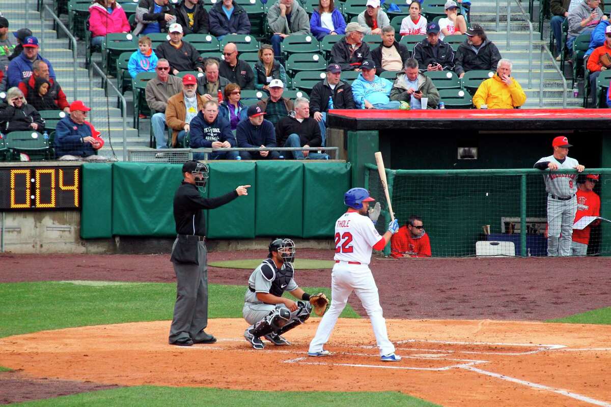 FILE - In this April 9, 2015, file photo, home plate umpire Seth Buckminster signals for the pitch as Buffalo Bisons batter Josh Thole (22) steps into the box during a Triple-A baseball game between the Bisons and Rochester Red Wings in Buffalo, N.Y. The displaced Toronto Blue Jays will play in Buffalo, New York, this year amid the pandemic. An official familiar with the matter told The Associated Press on Friday that the Blue Jays will play at Sahlen Field. The official spoke on condition of anonymity as they were not authorized to speak publicly ahead of an announcement. (AP Photo/Bill Wippert, File