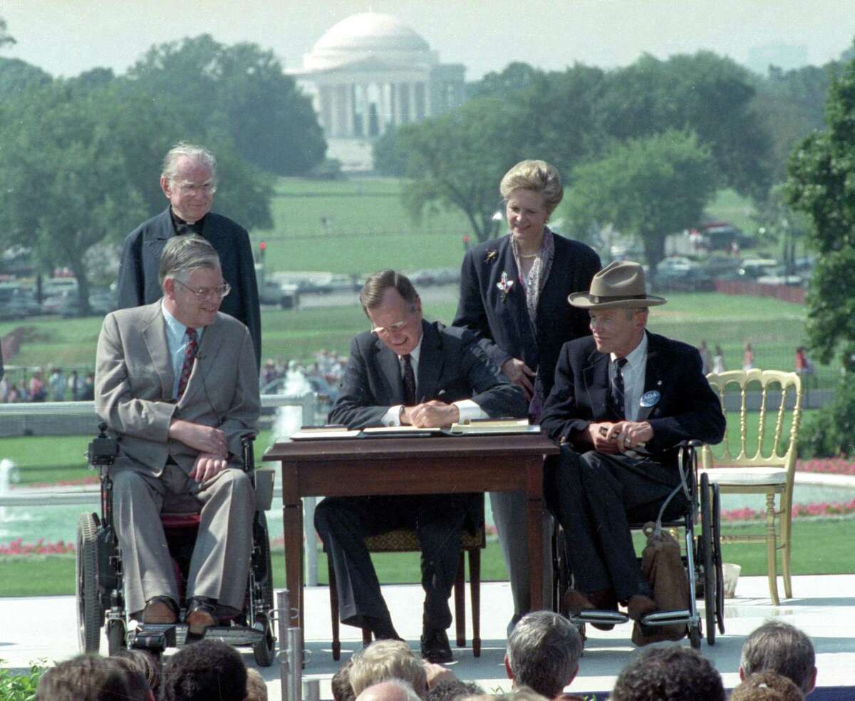 President George H. W. Bush signs the Americans with Disabilities Act during a ceremony on the South Lawn of the White House 30 years ago. It was an incredible feat, but much work remains.