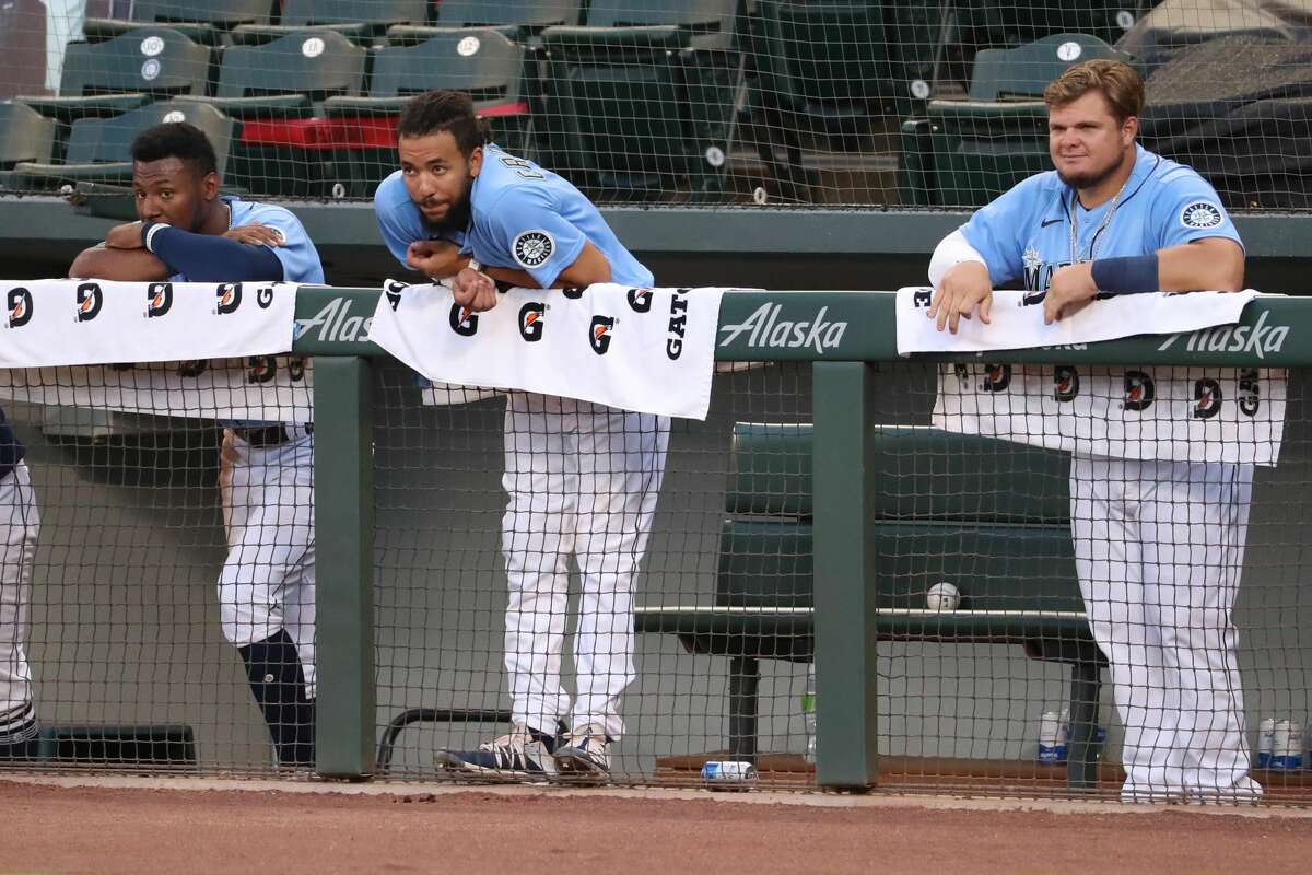 SEATTLE, WASHINGTON - JULY 19: (L-R) Kyle Lewis #1, J.P. Crawford #3 and Daniel Vogelbach #20 of the Seattle Mariners watch play in the seventh inning during a summer workout intrasquad game at T-Mobile Park on July 19, 2020 in Seattle, Washington. (Photo by Abbie Parr/Getty Images)