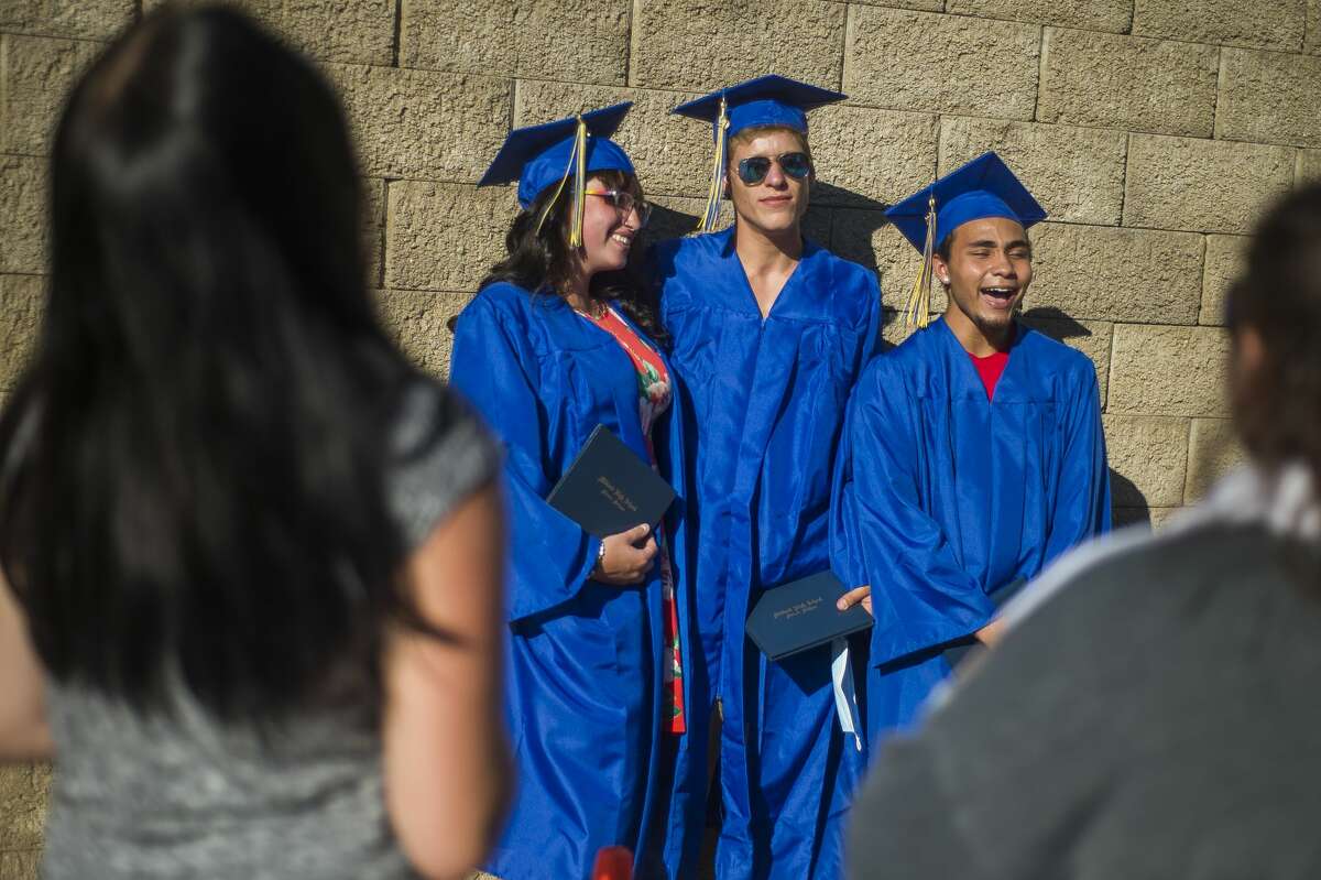 Graduating seniors from Midland High School celebrate during a socially distanced commencement ceremony Friday, July 24, 2020 at Dow Diamond. (Katy Kildee/kkildee@mdn.net)