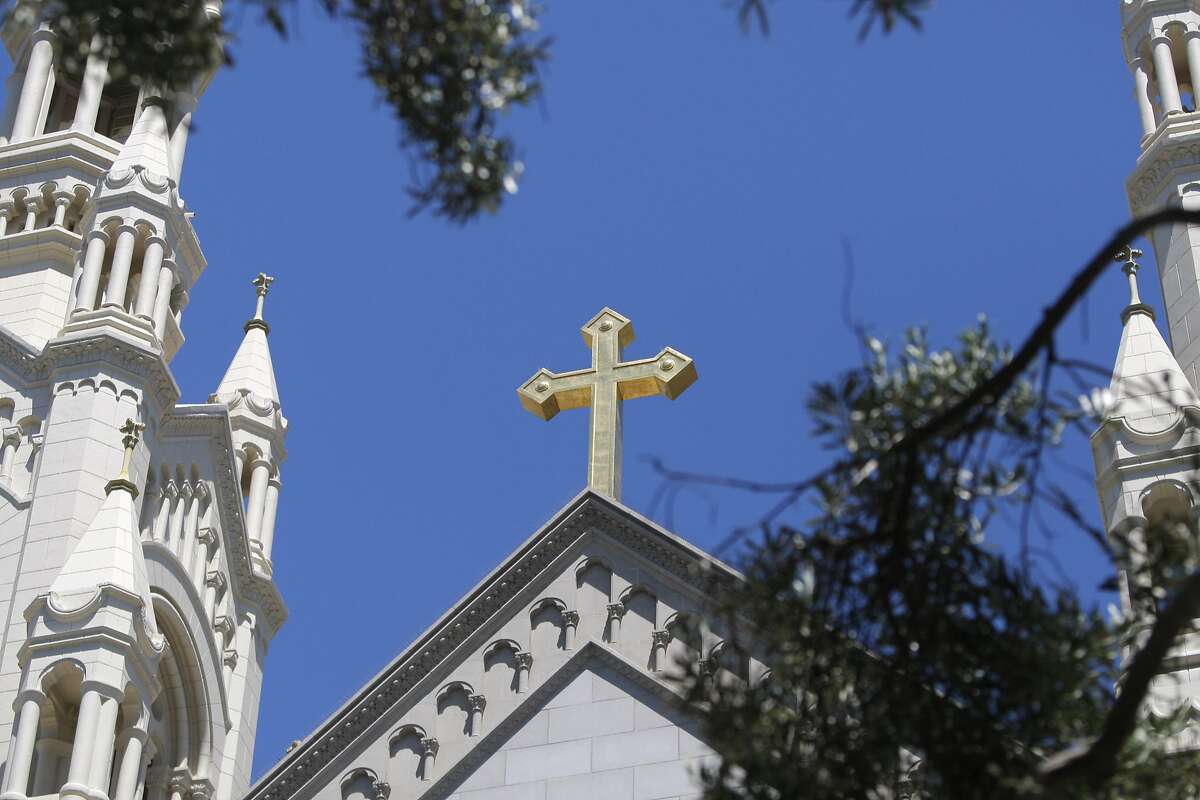 A cross above the Saints Peter and Paul church, in Washington Square Park, is seen on Sunday, July 29, 2012 in San Francisco, Calif.