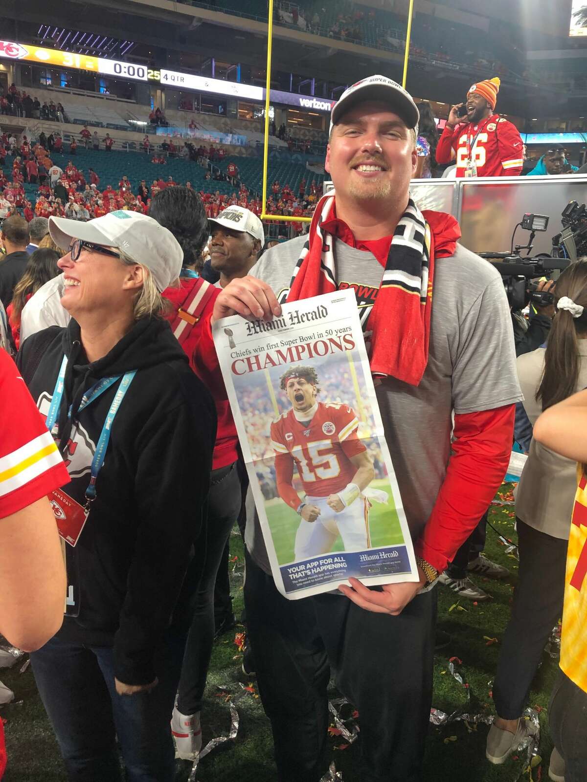 Kansas City Chiefs' Andrew Wylie displays the front page of the Miami Herald following his team's Super Bowl LIV victory over the San Francisco 49ers on Feb. 2, 2020.
