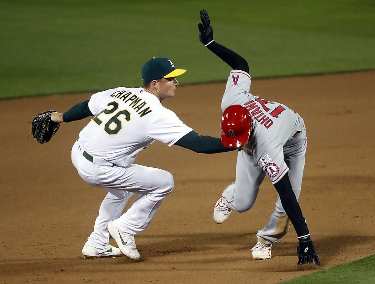 In 1st MLB game with new extra-inning rule, A's slam Angels