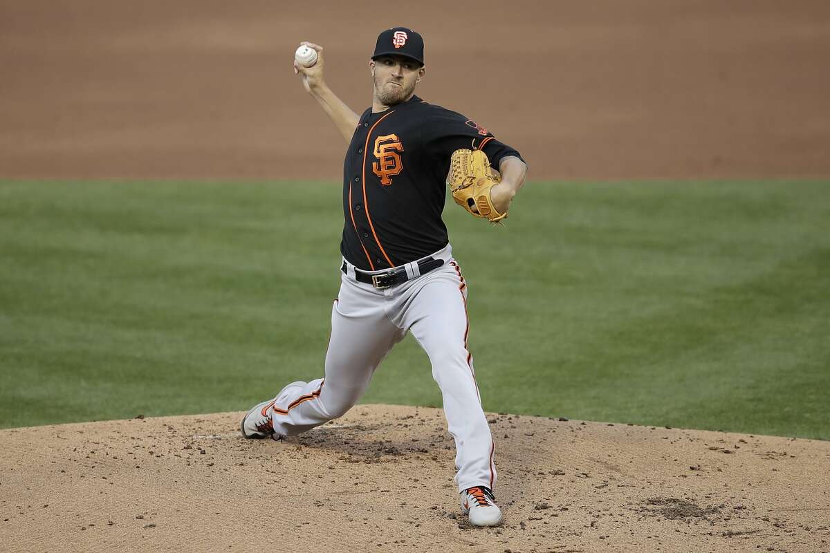San Francisco Giants' Kevin Gausman works against the Oakland Athletics in the first inning of an exhibition baseball game Monday, July 20, 2020, in Oakland, Calif. (AP Photo/Ben Margot)
