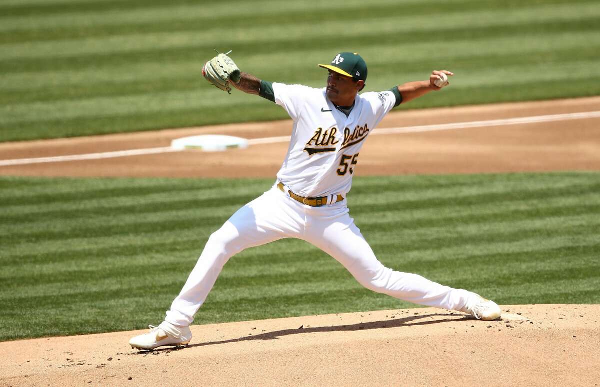 OAKLAND, CALIFORNIA - JULY 25: Sean Manaea #55 of the Oakland Athletics pitches against the Los Angeles Angels in the first inning at Oakland-Alameda County Coliseum on July 25, 2020 in Oakland, California. The 2020 season had been postponed since March due to the COVID-19 pandemic. (Photo by Ezra Shaw/Getty Images)