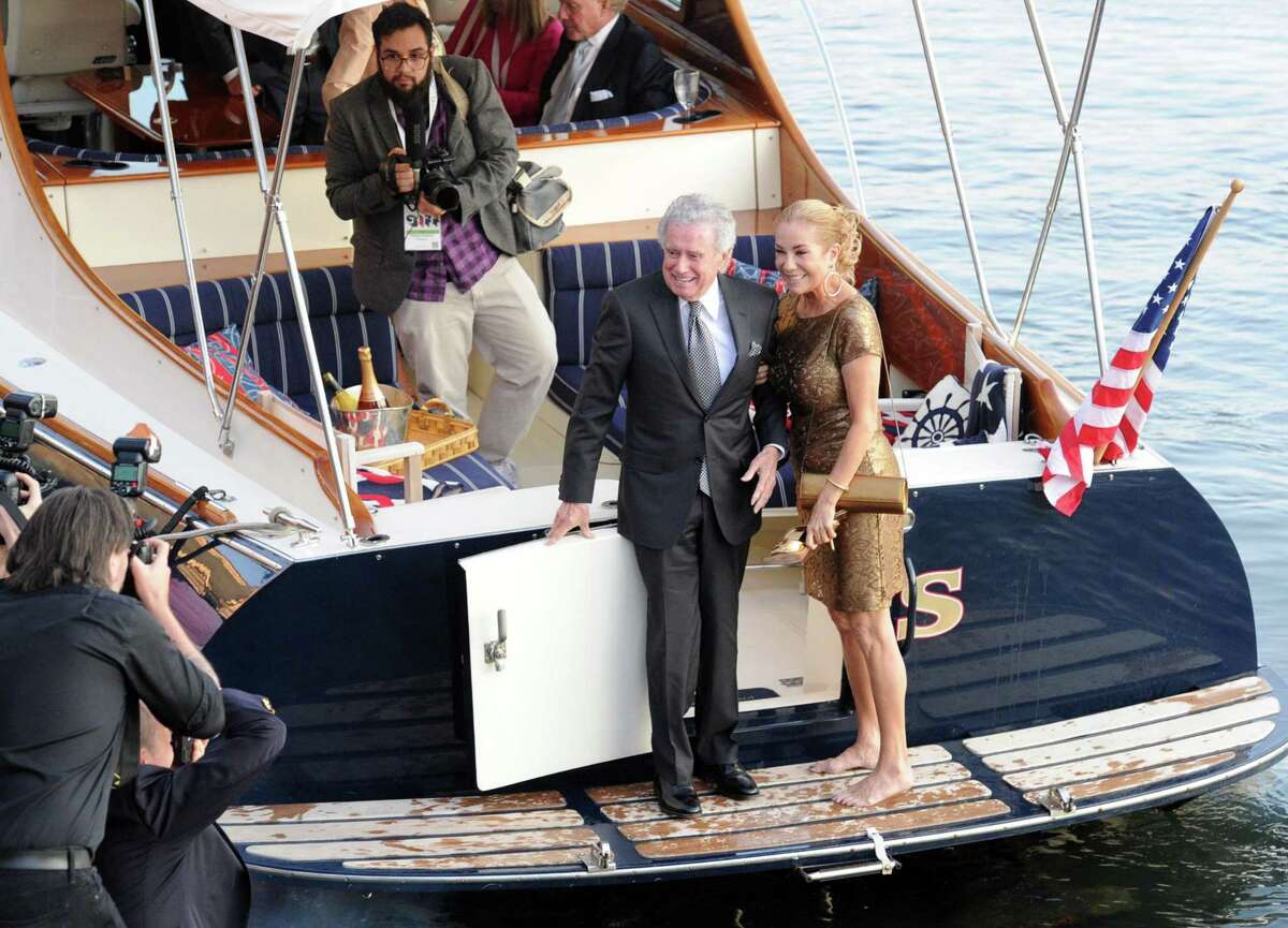 Regis Philbin, left, and KathieLee Gifford arrive by boat during the Greenwich International Film Festival Gala honoring Harry Belafonte for his philanthropic work with UNICEF at L'escale Restaurant & Bar in Greenwich, Conn., Saturday night, June 6, 2015. Philbin and Gifford were the Master of Ceremonies for the gala.