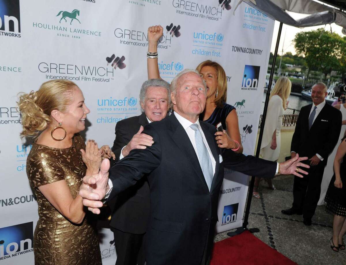 At center, N.Y. Giant football legend, Frank Gifford of Greenwich hams it up for the cameras during the Greenwich International Film Festival Gala honoring Harry Belafonte for his philanthropic work with UNICEF at L'escale Restaurant & Bar in Greenwich, Conn., Saturday night, June 6, 2015. At left is Gifford's wife, Kathie Lee Gifford, with Regis Philbin (behind Frank Gifford) and Hoda Kotb at right.