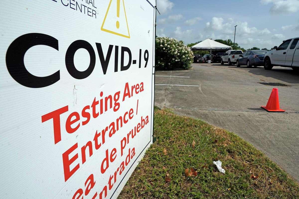 People wait inside their vehicles while in line at a United Memorial Medical Center COVID-19 testing site during the coronavirus pandemic Thursday, July 16, 2020, in Houston. (AP Photo/David J. Phillip)