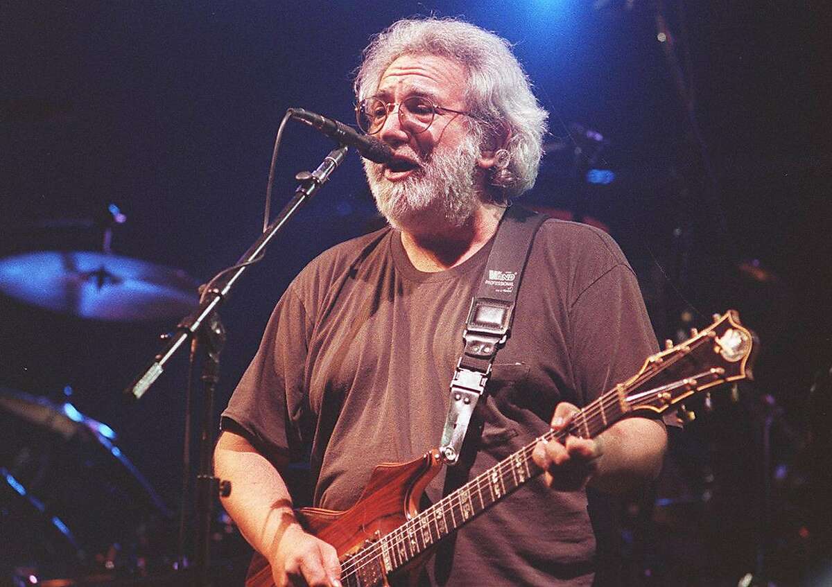 Jerry Garcia plays at a Grateful Dead concert at the Oakland Coliseum on December 12, 1992.