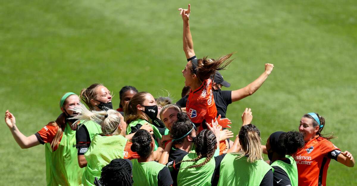 Shea Groom #6 of Houston Dash celebrates with her teammates after scoring a goal in the 91st minute against Alyssa Naeher #1 of Chicago Red Stars during the second half in the championship game of the NWSL Challenge Cup at Rio Tinto Stadium on July 26, 2020 in Sandy, Utah. (Photo by Maddie Meyer/Getty Images)