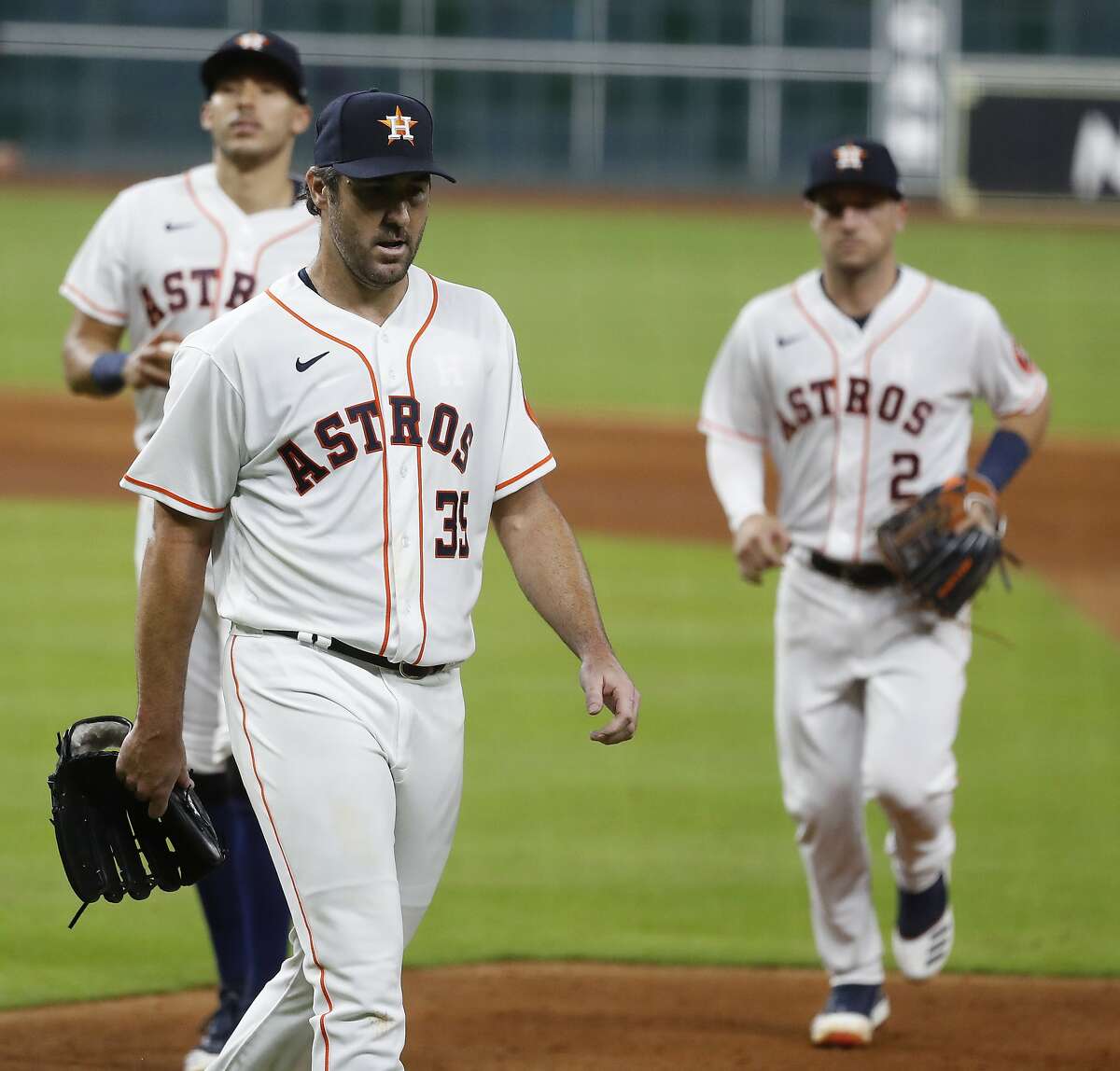 Houston Astros pitcher Justin Verlander walks back to the dugout after the sixth inning of an MLB Opening Day at Minute Maid Park, Friday, July 24, 2020, in Houston.
