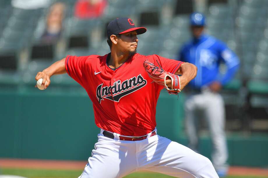 CLEVELAND, OHIO - JULY 26: Starting pitcher Carlos Carrasco #59 of the Cleveland Indians pitches during the seventh inning against the Kansas City Royals at Progressive Field on July 26, 2020 in Cleveland, Ohio. The 2020 season had been postponed since March due to the COVID-19 pandemic. (Photo by Jason Miller/Getty Images) Photo: Jason Miller / Getty Images