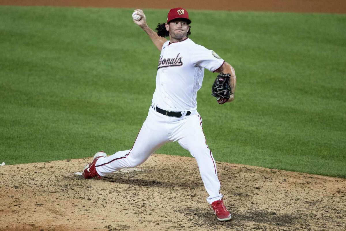 Washington Nationals relief pitcher Kyle Finnegan throws during the ninth inning of a baseball game against the New York Yankees at Nationals Park, Saturday, July 25, 2020, in Washington. (AP Photo/Alex Brandon)