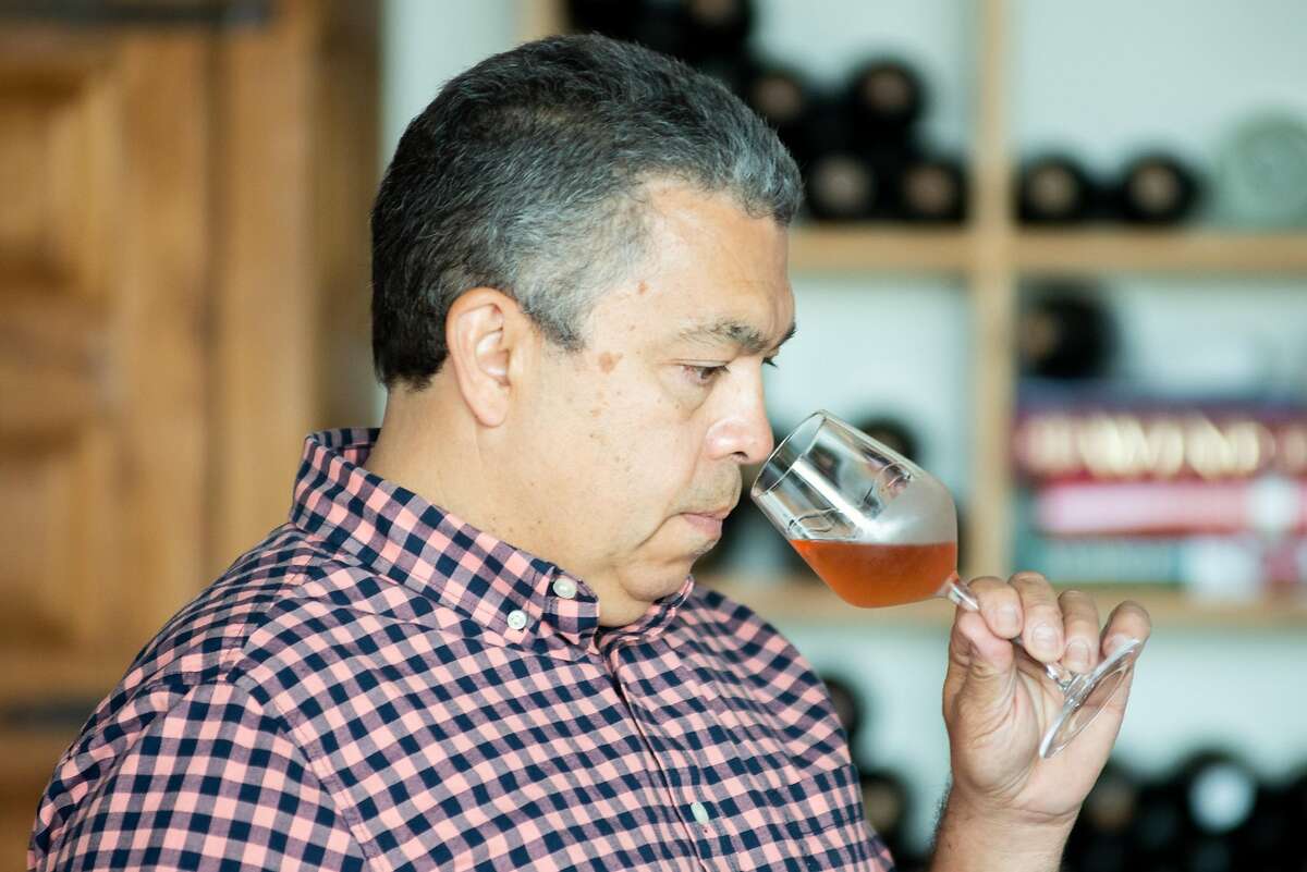 Noel Diaz, wine maker of Purity Wines, smelling a glass of wine on July 24, 2020 in Richmond, Calif.