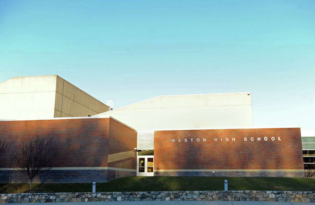 A Weston High School employee has tested positive for the coronavirus, officials said Tuesday.