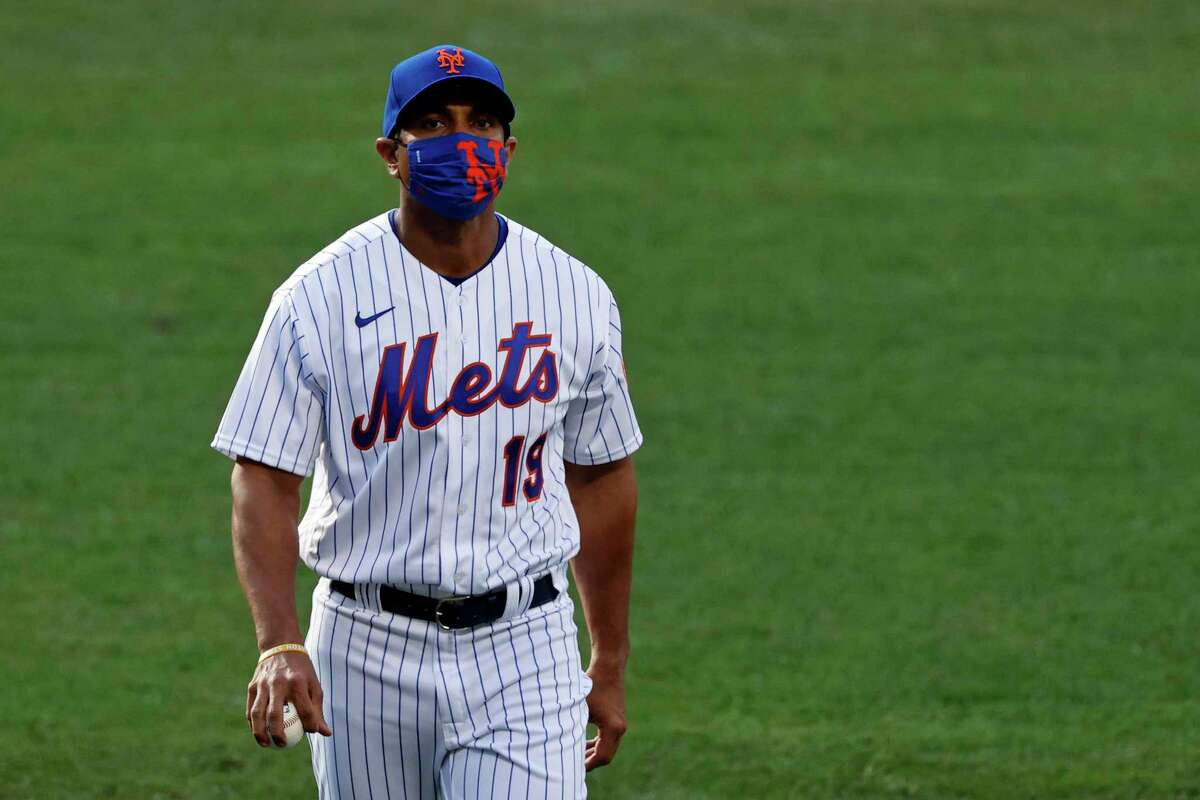 Mets manager Luis Rojas walks to the dugout against the Braves on Saturday in New York.