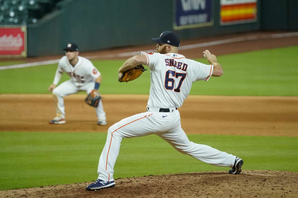 Houston Astros relief pitcher Cy Sneed (67) pitches during the eighth inning of a game between the Houston Astros and Seattle Mariners on Monday, July 27, 2020, at Minute Maid Park in Houston.